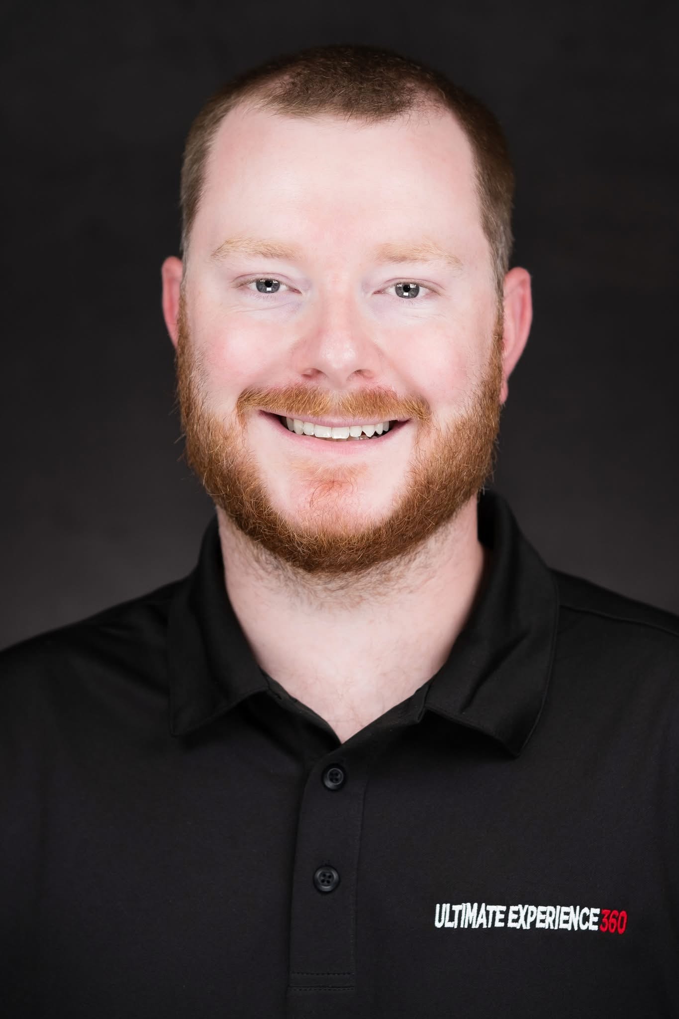 Owner of Ultimate Experience 360 in branded polo shirt
